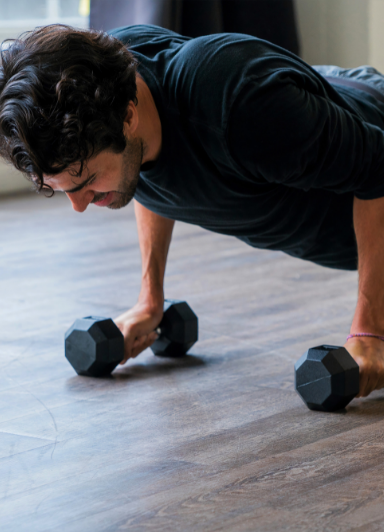A man exercising on the floor